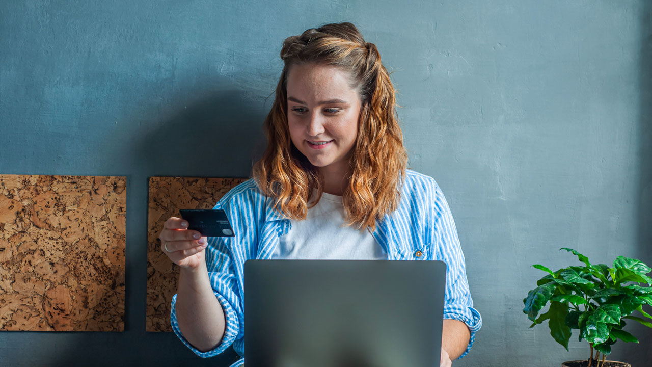 woman buying something on her laptop