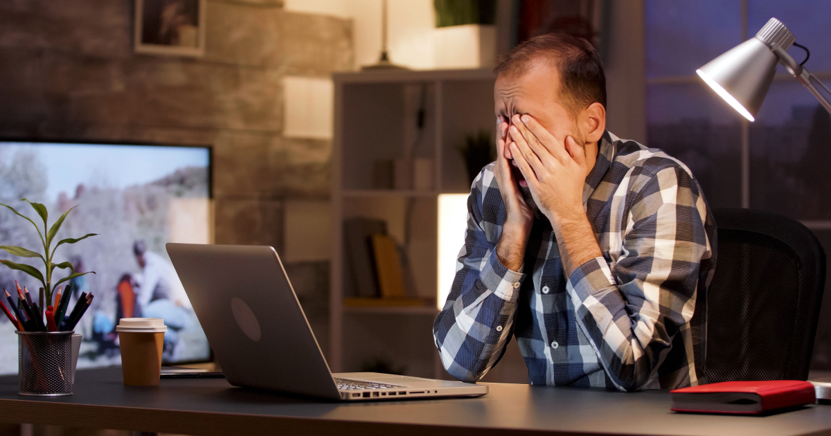 man frustrated with laptop